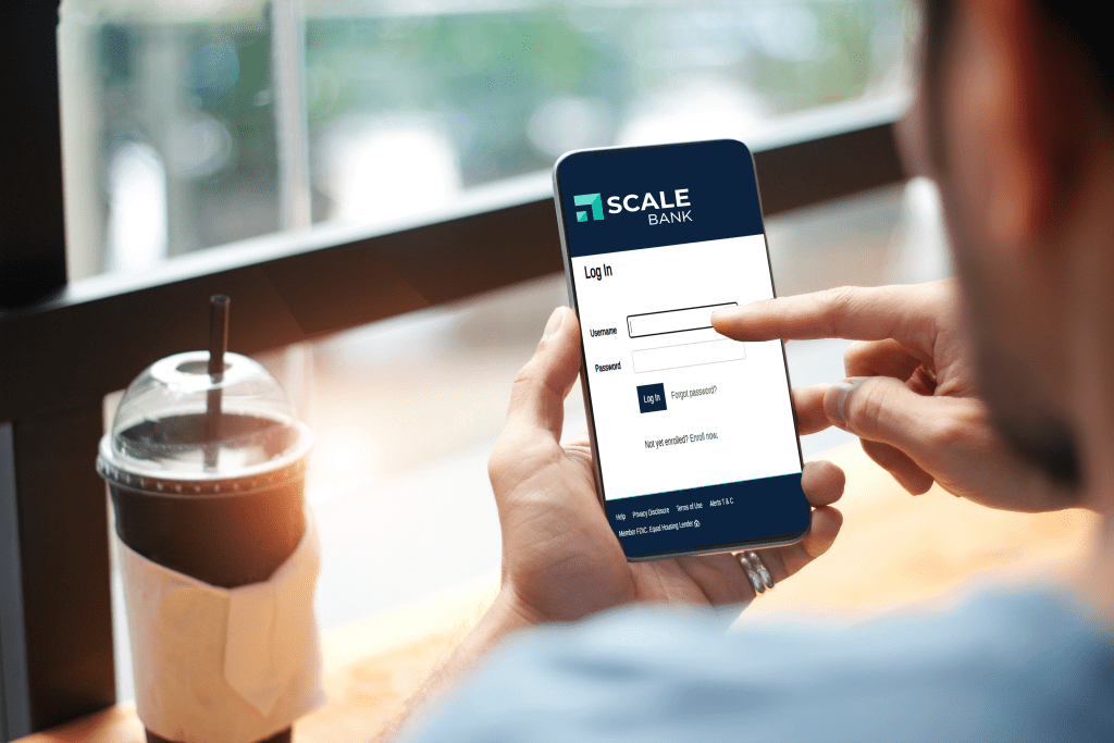 Person on mobile device signing into online banking.