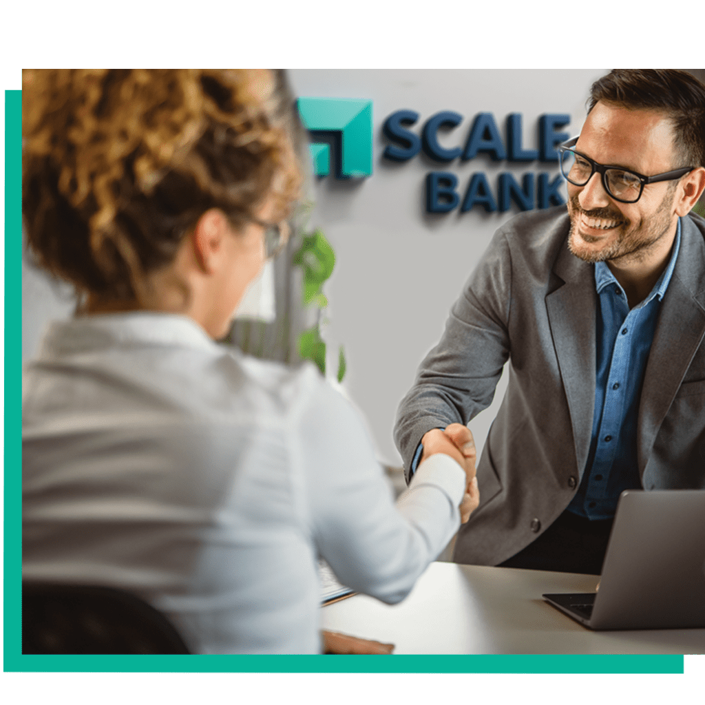 A warehouse lender and a mortgage banker shaking hands.