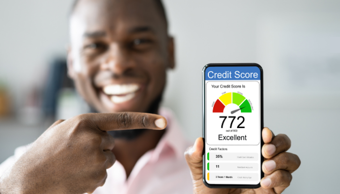 A man holding up his business credit score.