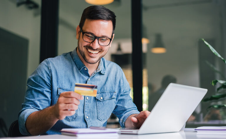 Customer entering credit card details on a laptop