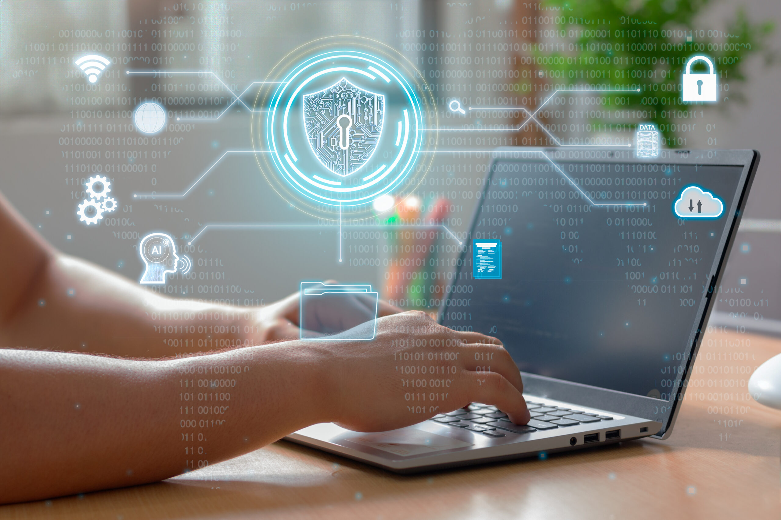 Person at computer that shows fraud prevention icons. 