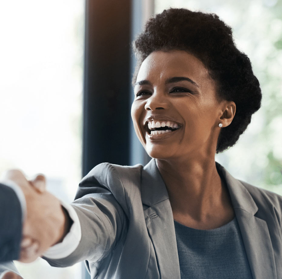 Smiling business woman shaking hands